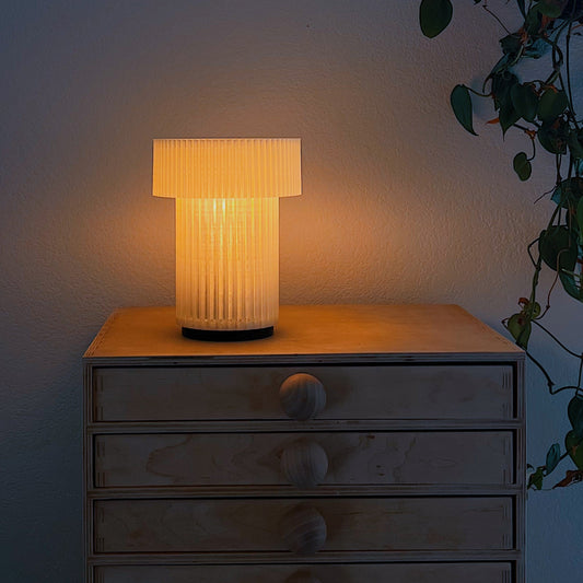 Wooj Design cordless mini drum lamp with 3D printed modern design, rechargeable table lamp, compact and stylish decor piece.