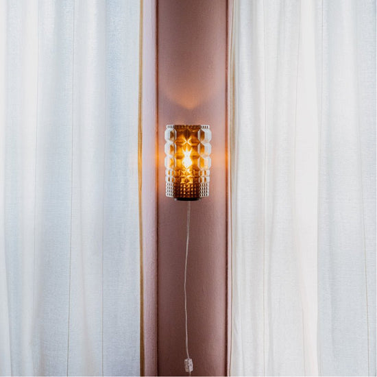 Wooj Design Gem Sconce featuring a modern geometric glass design and sleek metal mounting bracket.