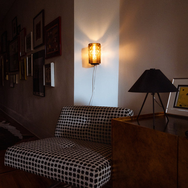 Wooj Design Gem Sconce featuring a modern geometric glass shade and sleek metal mounting for stylish wall lighting