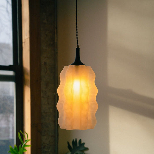 Wavy Pendant lamp by Wooj Design featuring a modern, curved design in a sleek finish, hanging from the ceiling.