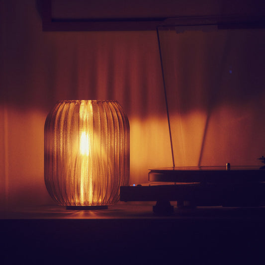 Wooj Design smoke-colored Allium Lamp with a modern, sculptural glass design suitable for contemporary home decor.