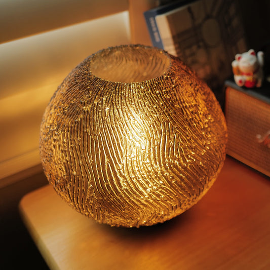 Smoke coral glass lamp by Wooj Design featuring a sleek, modern design with a soft glow and textured surface.