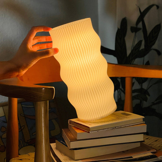 Terra Labs Wub Table Lamp with a modern design, featuring a sleek base and a colorful, adjustable lampshade.