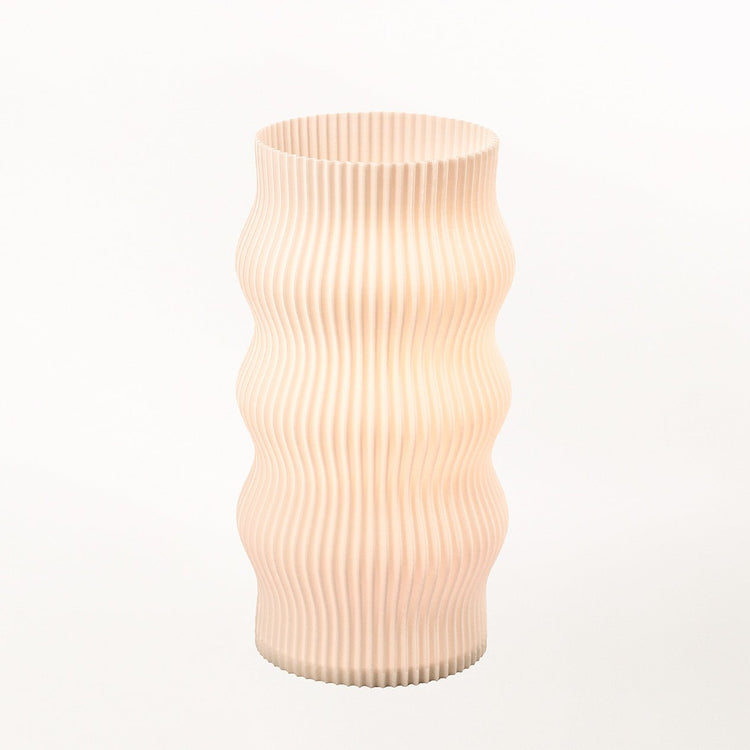 Terra Labs Wub Table Lamp with a sleek, modern design featuring a curved base and a cylindrical lampshade.