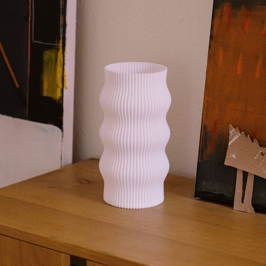 Terra Labs Wub Table Lamp featuring a modern, sculptural design with a smooth, curved shape and soft lighting.